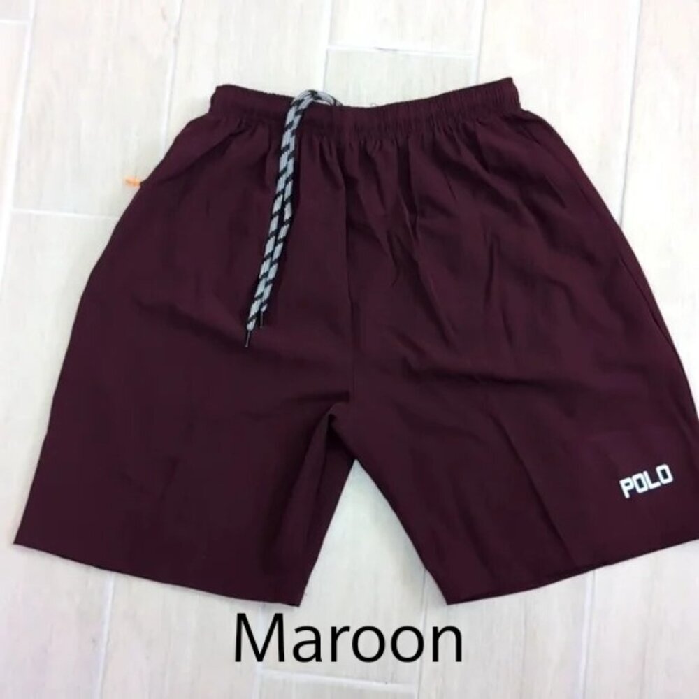 Athletic drawstring shorts with zipper pockets in MAROON color youth sizes